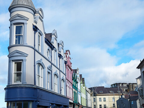 A very thin building at the junction of two streets in Caernarfon town centre Wales, UK