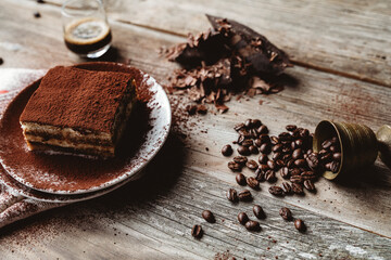 Tiramisu on dark backround, tiramisu and coffee 