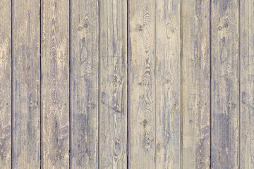 The texture of a wooden fence made of rough shabby boards