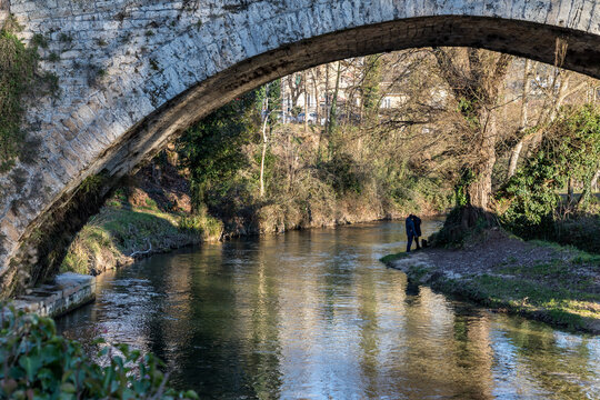 Silhouette of a couple of lovers at the medieval Ponte di San Francesco bridge, Subiaco, Italy 