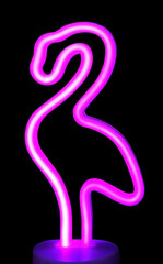 Obraz premium Neon pink flamingo isolated on black background. Stylish LED lamp made of flexible neon. Trendy summer silhouette.