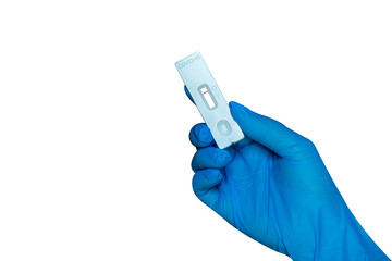 Hand holding Rapid Antigen Test kit (ATK)with Negative result during swab COVID-19 testing.