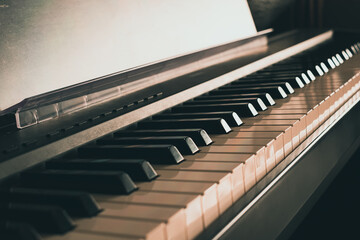 Photo of Piano keyboard in classic tone .