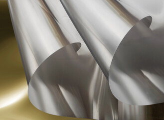 aluminum sheet. two sheets of thin aluminum foil metallic material with rolled edges on a blurred background