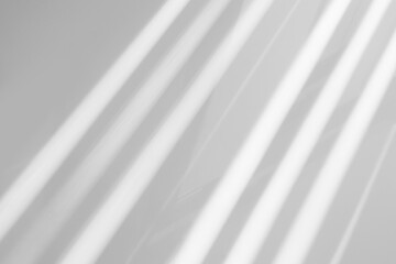 Obraz premium Gray window shadow and light blur abstract background on white wall, shadow overlay effect