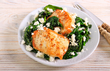 Chicken fillet over spinach with feta