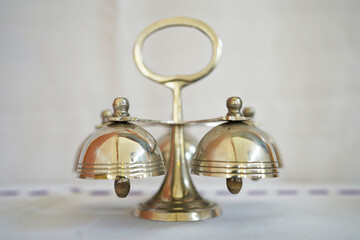 Metal mass bell on white background.