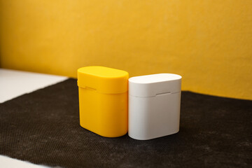 Bright musical headphones lie on a table