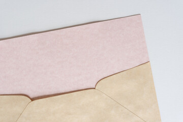 Fototapeta premium old paper envelope with pink paper