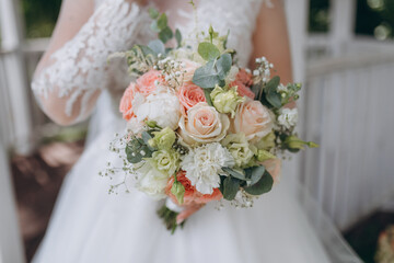 style, floral arranging, wedding concept. young woman dressed in extremely beautiful snowy white...