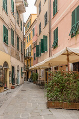 Fototapeta na wymiar picturesque houses on narrow street at historical village, Riomaggiore, Italy