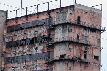 Fototapeta premium Old vintage ruined plant or factory. Soviet architecture