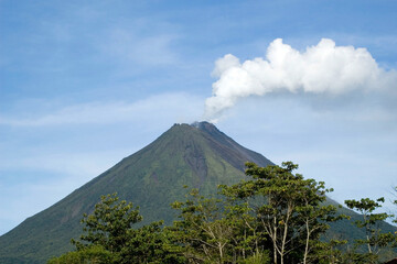  Arenal volcano with smoke comming out of the crater. Dormant since 2010.