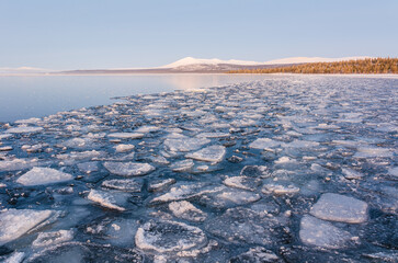 Ice blocks on frozen lake