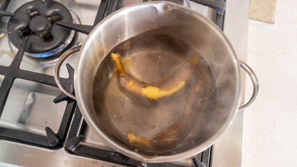 Boiled banana in the pot. High calories snack. Traditional Thai dessert. Boiled banana with banana leaf.