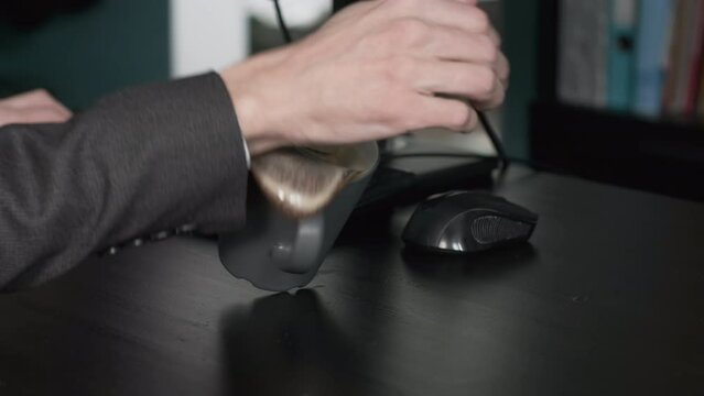 Male Office Worker Accidentally Spilling Coffee on his Desk while Working. Business and Lifestyle Concept
