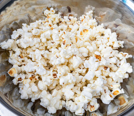 Fresh popcorn in a metal bowl