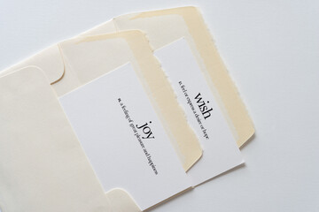 two envelopes with two cards each with words "joy" and "wish" and their definiton