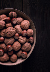 Walnut and hazelnut, close-up, top view, selective focus, toned image, rustic, food background,