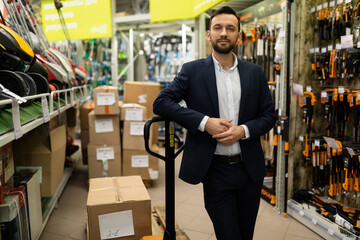 merchandiser in a hardware store in the tool and garden equipment department