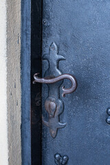 A handle at metal door in town of Kosice , Slovakia.