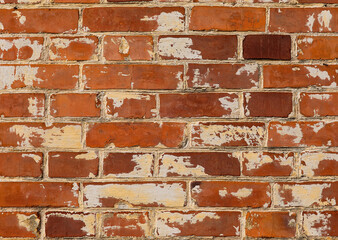 The wall of an old brick house. Red brick.