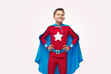 Proud smiling superhero child in costume © kegfire