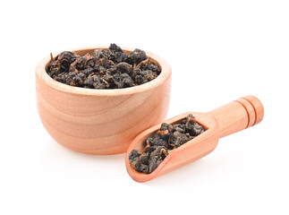 Chinese oolong tea Tie GuanYin in white wooden bowl and scoop on white background.