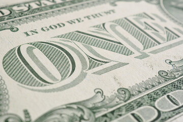 American paper money. 1 US dollar bill. Word one close-up. Background or wallpaper on the theme of the USA economy and business. Federal reserve note. Macro