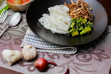 Thai vermicelli eaten with curry or Thai rice noodle with peanut sauce. It is a popular street food that Thai people eat and is widely available in Thailand.