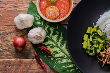 Thai vermicelli eaten with curry or Thai rice noodle with peanut sauce. It is a popular street food that Thai people eat and is widely available in Thailand.
