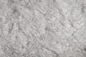 White background, faux fur texture. Synthetic fabric.