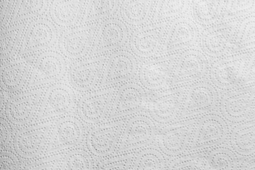 The texture of a white paper towel with a pattern.