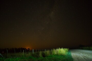 dirt road in the field at night