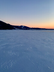 Ice field and distant mountains