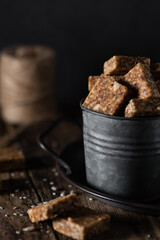 selective focus home made dates and nuts candy in tin jar rustic style