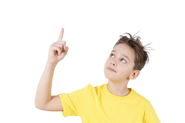Isolated on a white background portrait of a boy who points up with his finger.