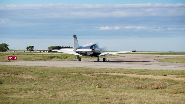 Small Aircraft Taxis onto Runway