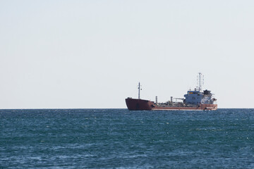 dry cargo ship in the sea sails at the rate
