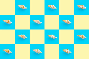 Flat Lay wallpaper background image of coastal seashells on a checkered background