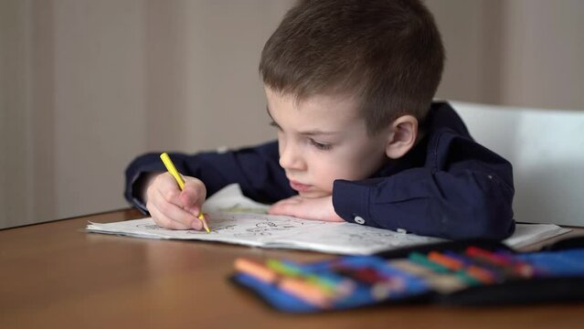 Preschool kid drawing at home. Hobby concept