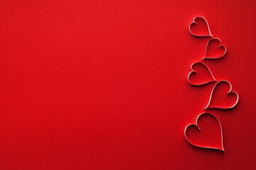 Obraz na płótnie Canvas Handmade gift card with copyspace. Paper hearts on red background.
