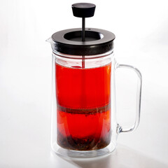 Hot raspberry tea in a glass mug for brewing