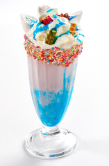 Milkshake garnished with whipped cream and marshmallows