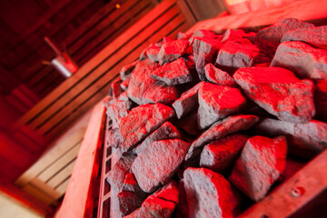 Empty wooden steam room with stone heater.Sauna room for good health.Healthy and spa life style.