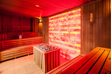 Empty wooden steam room with stone heater.Sauna room for good health.Healthy and spa life style.