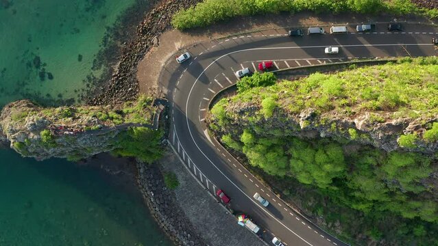 Maconde beach bathing in beautiful sunlight with amazing surrounding landscape. Aerial shot of beautiful Mauritius scenery.