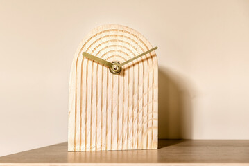 Interesting standing beige yellow clock in a form of semi oval with grooves lines. 