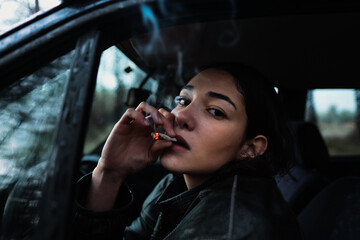 woman photographed in classic car