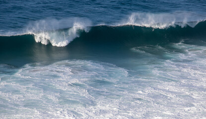 White crested waves roll into the beach at Robberg Nature Reserve from the Atlantic ocean